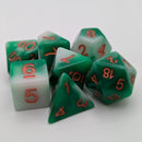 Set of green polyhedral dice with red numbers on a white background