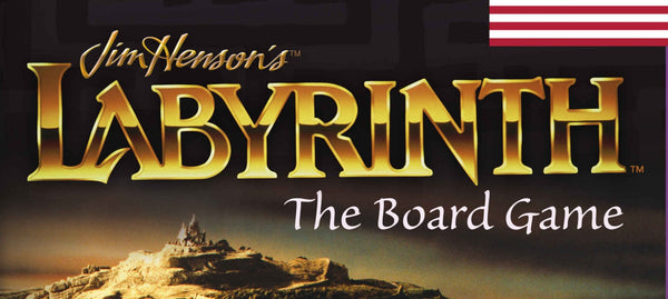 A photo of the Title from Labyrinth the Board Game, as read on the box. The words Jim Henson's Labyrinth The Board Game are superimposed in stylized font in front of what appears to be a large maze. 