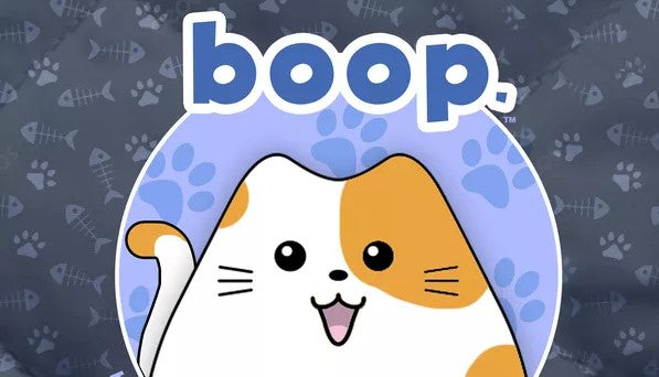 A section of the cover of boop, which shows a cartoon calico cat in a purple circle, against a black background with pawprints. The name of the game is written in purple bubble letters above the cat. 