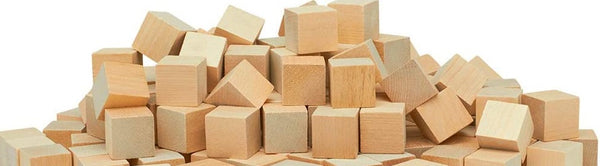 A photo of a large pile of wooden cubes, stacked against a white background