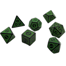 Set of green polyhedral dice on a white background