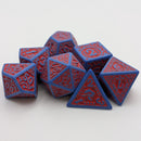 Blue and red polyhedral dice set on a white background