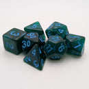 Set of green polyhedral dice with blue numbers on a white background