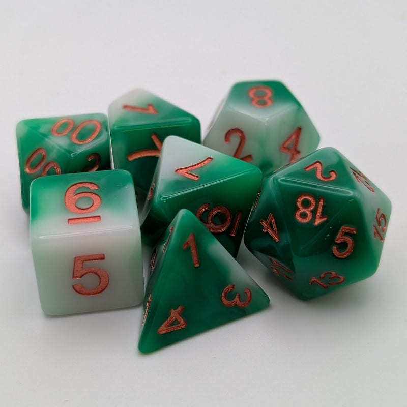 Set of green polyhedral dice with red numbers on a white background